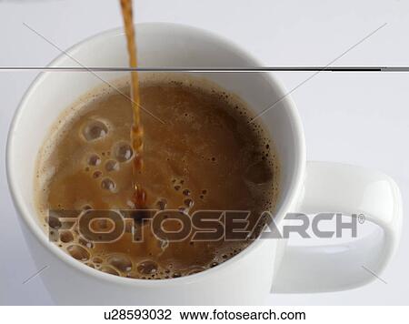 Pouring espresso into a cup View Large Photo Image Stock Image - Pouring espresso into a cup. Fotosearch