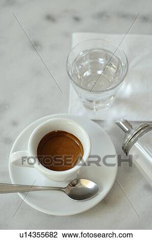 Stock Image - Espresso, tumbler and sugar dispenser. Fotosearch