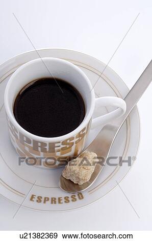 Espresso with brown lump of sugara View Large Photo Image Stock Photo - Espresso with brown lump of sugara. Fotosearch