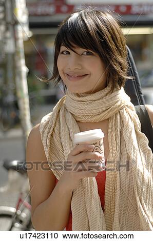 Stock Image - Girl with cappuccino mug. Fotosearch