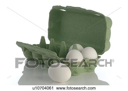 Stock Image - Egg carton with white chicken eggs. Fotosearch