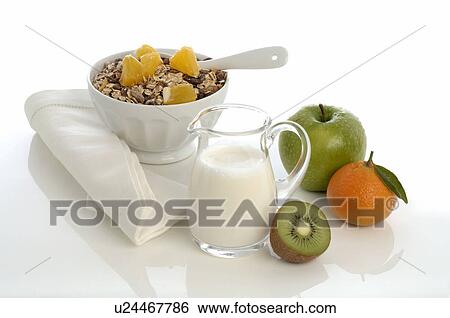 Stock Photograph - Muesli with apple, kiwi and tangerine. Fotosearch
