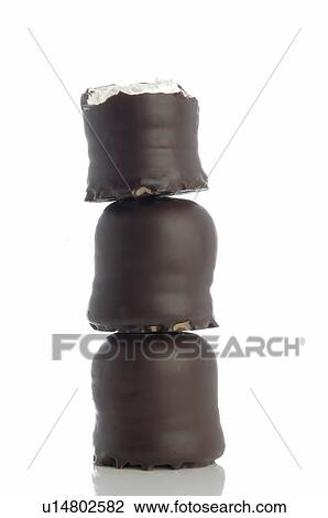 Stock Image - Piled chocolate marshmallows. Fotosearch