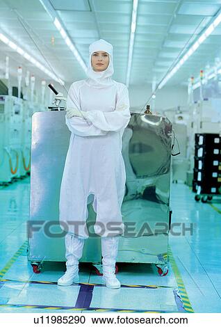 Stock Image - Female scientist standing in laboratory. Fotosearch