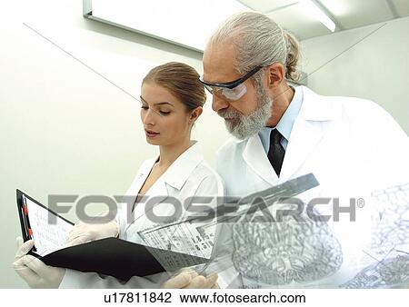file, light, protective glasses, holding, lab coat, looking View Large Photo Image Stock Image - file, light, protective glasses, holding, lab coat, looking. Fotosearch