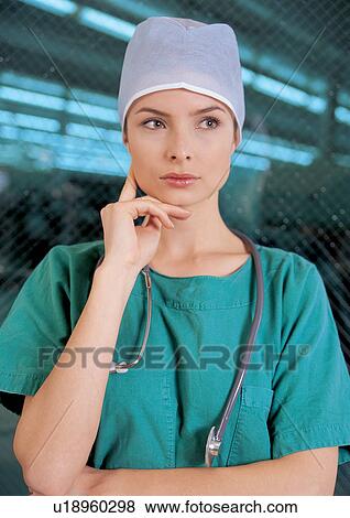 hand on chin, r&d matters, one person, r & d, doctor, green View Large Photo Image Stock Photo - hand on chin, r&d matters, one person, r & d, doctor, green. Fotosearch