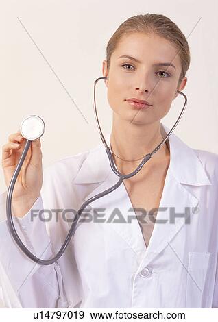 Stock Photo - one person, holding, r & d matters, doctor, lifestyle. Fotosearch