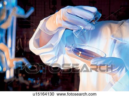Stock Image - Person working with a science culture . Fotosearch
