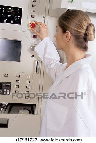 Stock Photo - researcher, coat, waist up, technician, lab coat, technology, young adult. Fotosearch