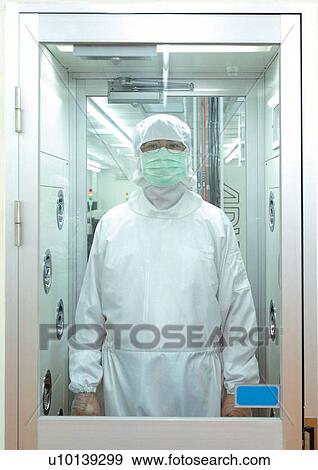 Stock Photo - Researcher standing in entrance to laboratory. Fotosearch