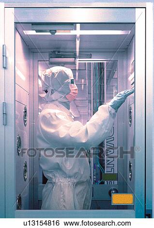 Scientist in protective clothing, side view View Large Photo Image Stock Photograph - Scientist in protective clothing, side view. Fotosearch