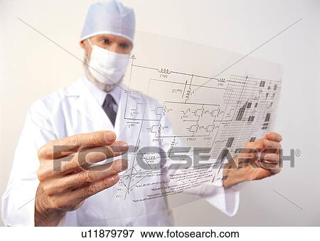 Scientist looking at diagram View Large Photo Image Stock Photo - Scientist looking at diagram. Fotosearch