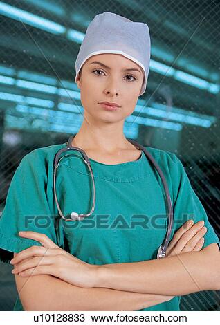 Serious, young female doctor with stethoscope View Large Photo Image Stock Image - Serious, young female doctor with stethoscope. Fotosearch