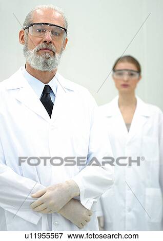 Stock Photo - technology, female, surgical gloves, elderly man, woman, r & d matters. Fotosearch