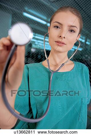 Young female doctor with stethoscope View Large Photo Image Stock Image - Young female doctor with stethoscope. Fotosearch