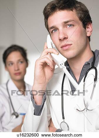 Doctor on the phone, portrait View Large Photo Image Stock Image - Doctor on the phone, portrait. Fotosearch