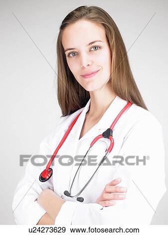 Doctor woman looking into the camera View Large Photo Image Stock Photo - Doctor woman looking into the camera. Fotosearch