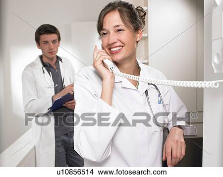 Doctors on the phone View Large Photo Image Picture - Doctors on the phone. Fotosearch