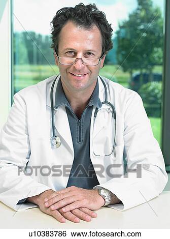 Portrait of mature male doctor. View Large Photo Image Stock Photograph - Portrait of mature male doctor.. Fotosearch