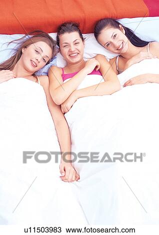 Stock Image - carefree, friends, happy, indoors leisure. Fotosearch