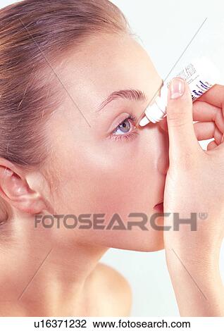 Stock Image - close-up, holding, young woman, one person, young adult. Fotosearch