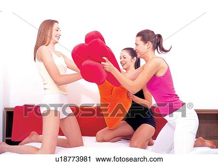 Stock Image - female, duvet, pushing, indoors, youth, recreation, beauty. Fotosearch
