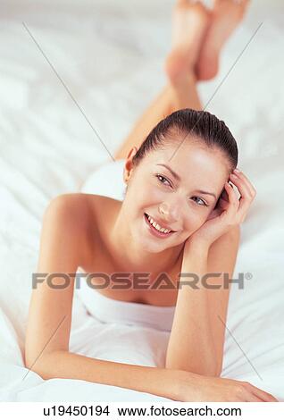 happy, indoors looking at camera, lying down View Large Photo Image Picture - happy, indoors looking at camera, lying down. Fotosearch