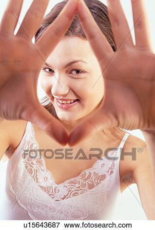 Stock Photo - happy, looking at camera, portrait, smiling. Fotosearch