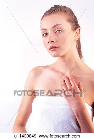 Stock Photo - health, bathrobes, woman, cosmetics, rubbing. Fotosearch