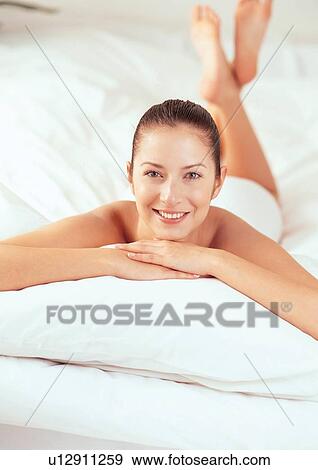 Stock Photo - human, bed, bedding, woman, white, female. Fotosearch