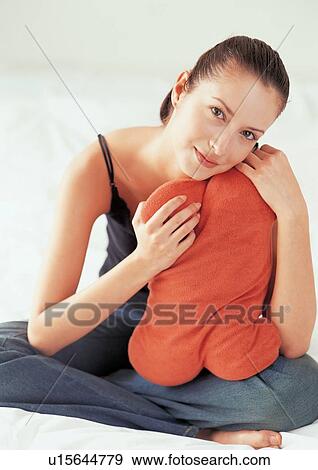 Stock Photo - human, young adult, looking at camera, smiling, happy, portrait, content. Fotosearch
