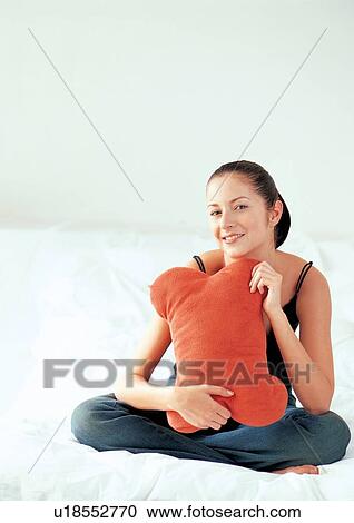looking at camera, portrait, sitting, young woman View Large Photo Image Stock Image - looking at camera, portrait, sitting, young woman. Fotosearch