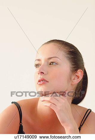 youth, one person, young adult, posing, indoors, young woman, hand chin View Large Photo Image Stock Photo - youth, one person, young adult, posing, indoors, young woman, hand chin. Fotosearch