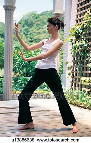 Stock Photo - Barefoot, Black, Casual Clothing. Fotosearch