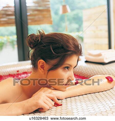 Stock Image - Glass, Leaning, One Young Woman Only, Indulgence, Day, Hair Back, Clothes. Fotosearch