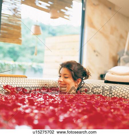 Stock Image - Stone, Relaxation, Young Adult, Female Beauty, Day, Dimple. Fotosearch