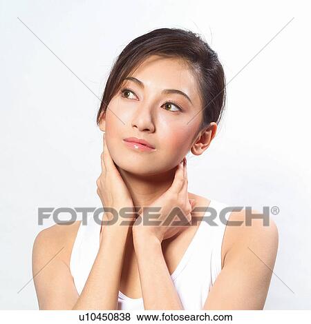 Stock Photo - Asian woman holding her neck . Fotosearch