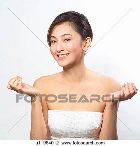 Stock Image - One Person, Looking At Camera, Young Adult, Human Face, Black Hair. Fotosearch