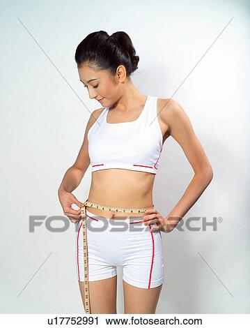Tape Measure, Exercising, Dieting, White Background, Body Care View Large Photo Image Stock Image - Tape Measure, Exercising, Dieting, White Background, Body Care. Fotosearch
