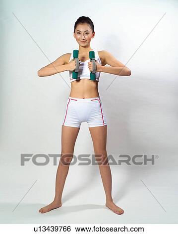 Stock Photograph - White Background, Hair Back, Sports Bra, Brown Hair, woman feature, Feature, Female feature. Fotosearch