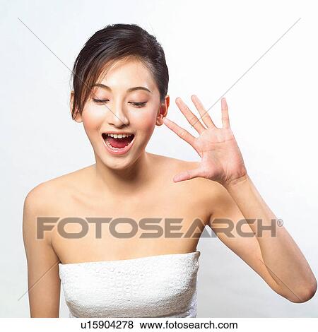 Stock Photo - Youth Culture, Human Face, Close-Up, Black Hair, Brown Hair, Real People, Tube Top. Fotosearch