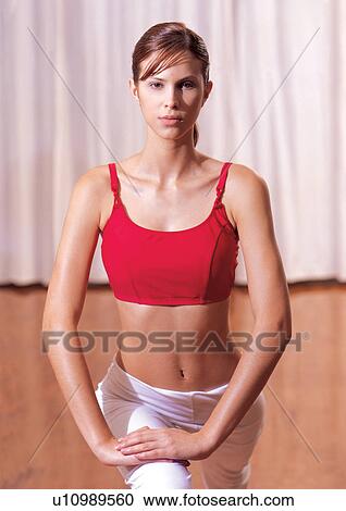 Stock Image - dedication, half length, sport, exercising, indoor. Fotosearch