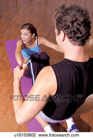 Stock Image - helping, stretching, energy, teaching, smiling, dedication. Fotosearch