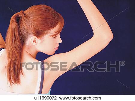 Stock Image - Red head working out. Fotosearch