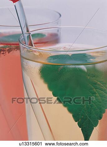 Stock Image - Close-Up, Glass, Green, Half Full, Indoor. Fotosearch