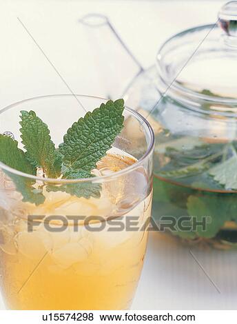 Stock Photo - Close-Up, Green, Half Full, Ice Cube. Fotosearch