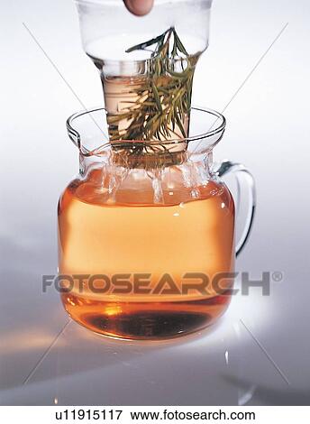 Stock Photo - Herb Tea, Half Full, Indoor, Two Objects, Close-Up. Fotosearch