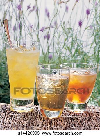 Stock Image - Medicinal Herb, Herb Tea, Alternative Medicine, Ice Tea, Focus On Foreground, Ice Cube. Fotosearch