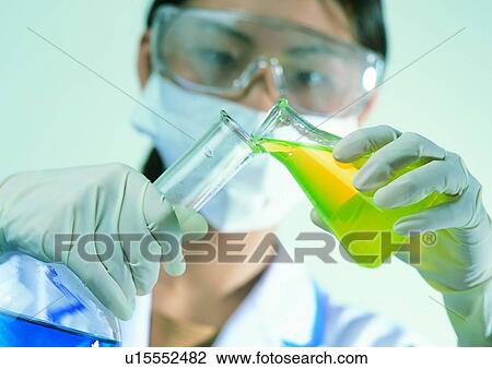 Stock Image - Tube, Liquid, Protective Eyewear, Eyeglasses, Beaker, One Person. Fotosearch