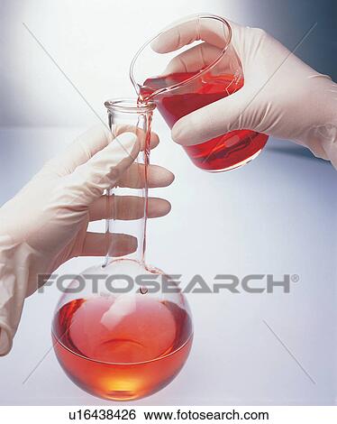 Stock Photograph - beaker, chemical, glass, human hands. Fotosearch